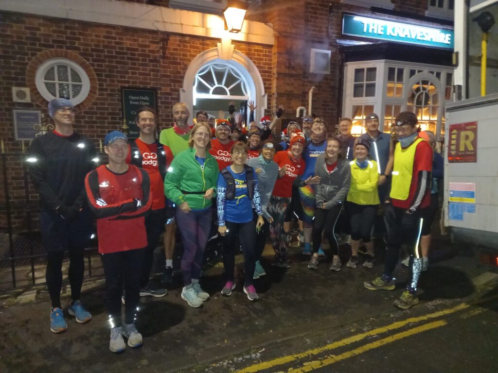 Large group of people in running kit and lights