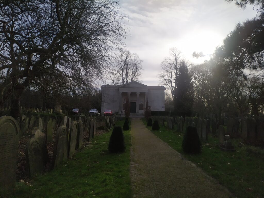 York Cemetery chapel viewed from the path through the trees