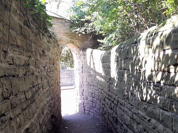 End of ginnel, an arch lit by the sunshine