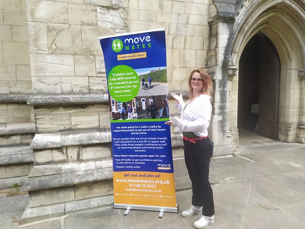 Sarah, with the Move Mates banner outside Selby Abbey